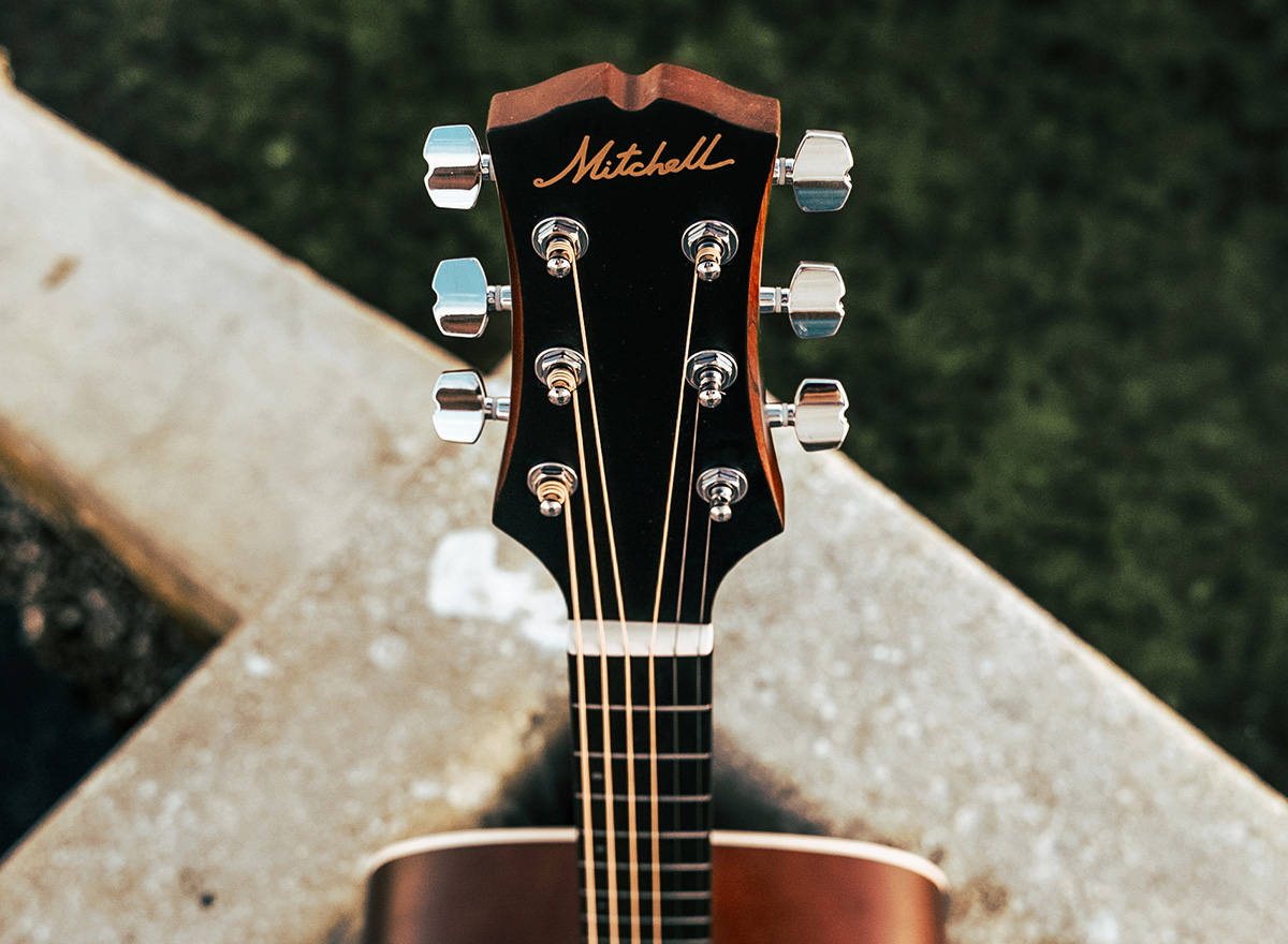Close-up of Mitchell acoustic guitar headstock and tuners